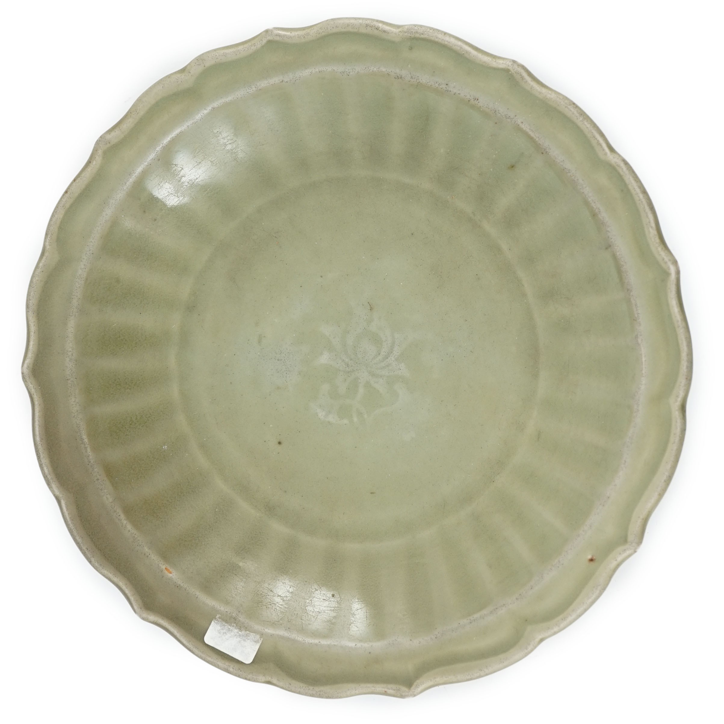 A Chinese Longquan celadon barbed rim dish, 15th century, 26.5cm wide, wear to glaze